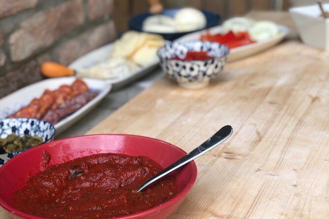 2-Hour Guided Family Pasta or Pizza Cooking Class in Acqui Terme - Stretching dough and firing the stone oven