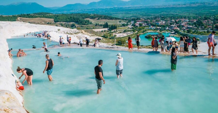 Antalya: Pamukkale Hot Springs & Hierapolis Small Group Tour - Walking through Hierapolis, the ancient spa city