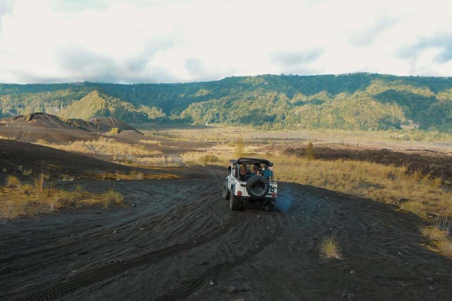 Bali: Day/Sunset Mount Batur 4WD Jeep and Natural Hot Spring - A Jeep route across Mount Batur’s black lava