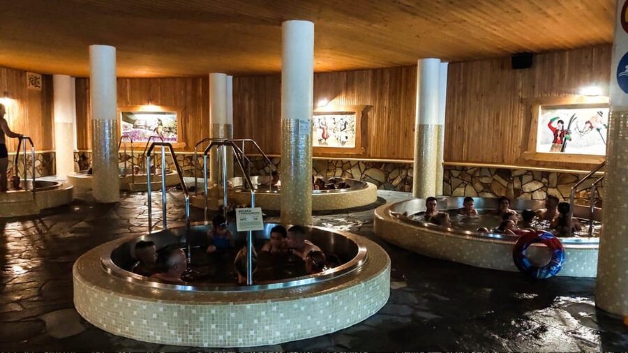 From Kraków: Thermal Baths Evening or Morning Experience - Jacuzzis, loungers, and water slides