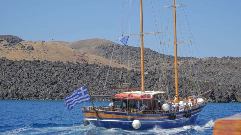 From Old Port:Volcanic Islands Boat Trip & Hot Spring Visit - A short boat ride from Fira to a volcanic world