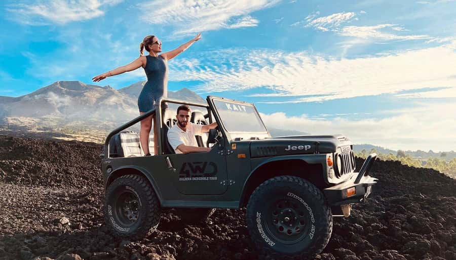 From Ubud: Mount Batur Shared Jeep Sunrise & Hot Spring Tour - The 4WD ride across black volcanic ground