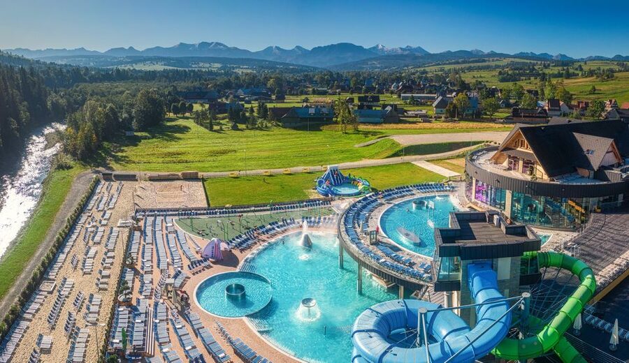 Krakow: Trip to Chocholow Thermal Baths in Tatra Mountains - Slides, sports, and water features