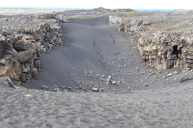 Lava, Craters and Hot Springs Private Tour - Hvalsneskirkja, a calm pause in stone