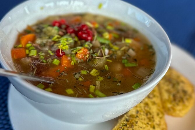 Luxury Northern Lights Yacht Cruise with Hot Tub from Tromsø - Reindeer soup, hot chocolate, and a warm saloon