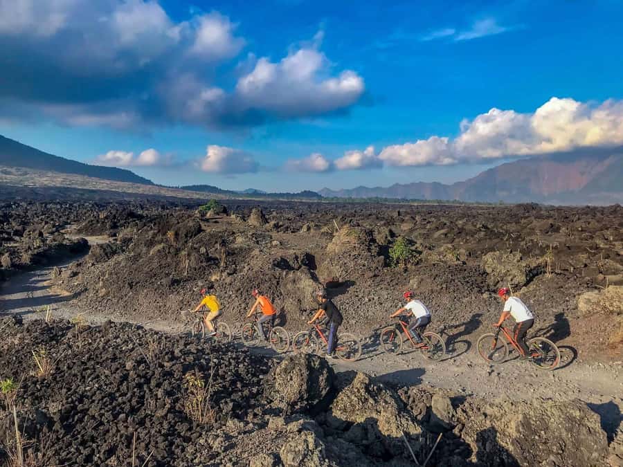 Mount Batur: Black Lava Cycling Tour w/ Natural Hot Spring - Lake Batur, the temple, and village roads