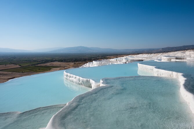 Pamukkale and Hierapolis Tour from Selcuk and Kusadasi - Walking through Hierapolis above the terraces