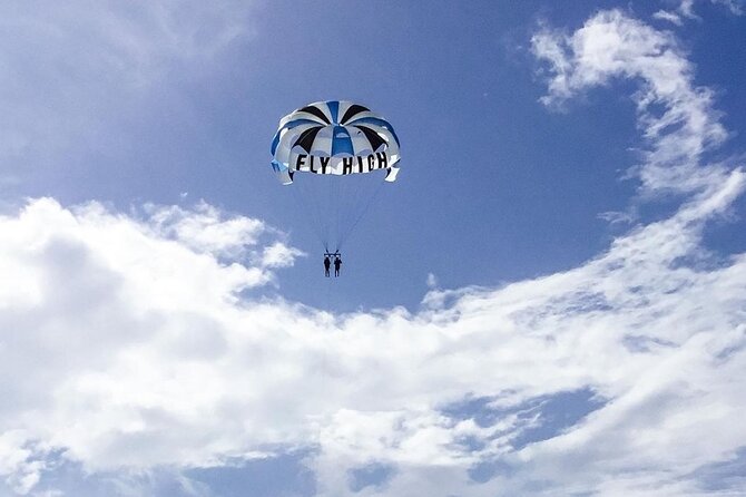 Parasailing, Blue Hole Mineral Spring, Seven Mile Beach - Puerto Seco Beach and the beach description to clarify