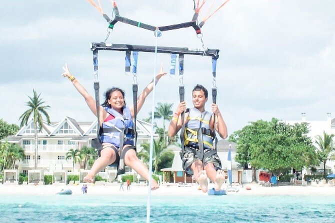 Parasailing, Blue Hole Mineral Spring, Seven Mile Beach - Who will enjoy this outing most