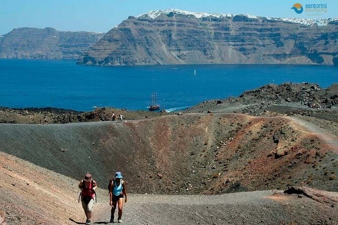 Santorini: Boat tour to Volcano, Hot Springs & Thirasia island - Sailing across the caldera to Nea Kameni